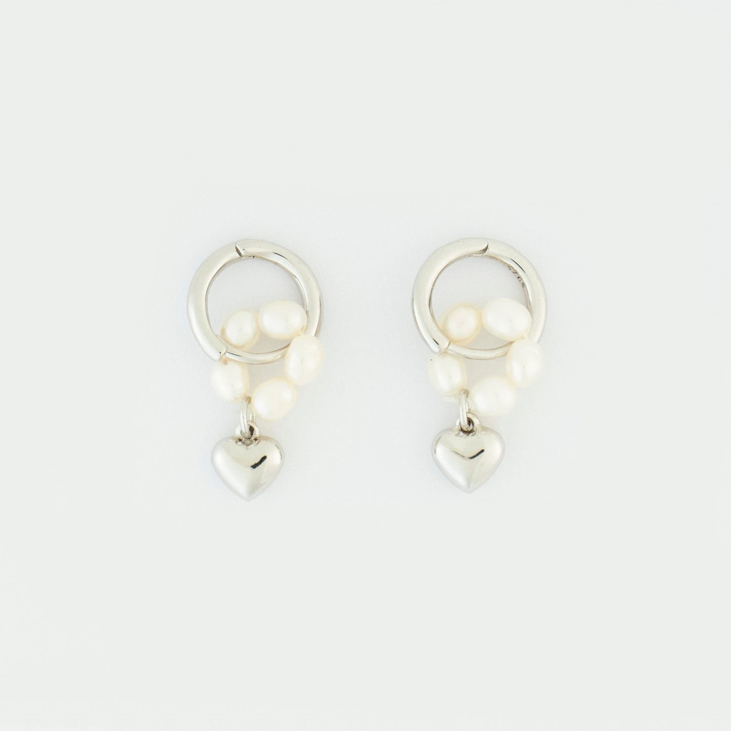 Embrace the timeless symbol of love with these earrings
