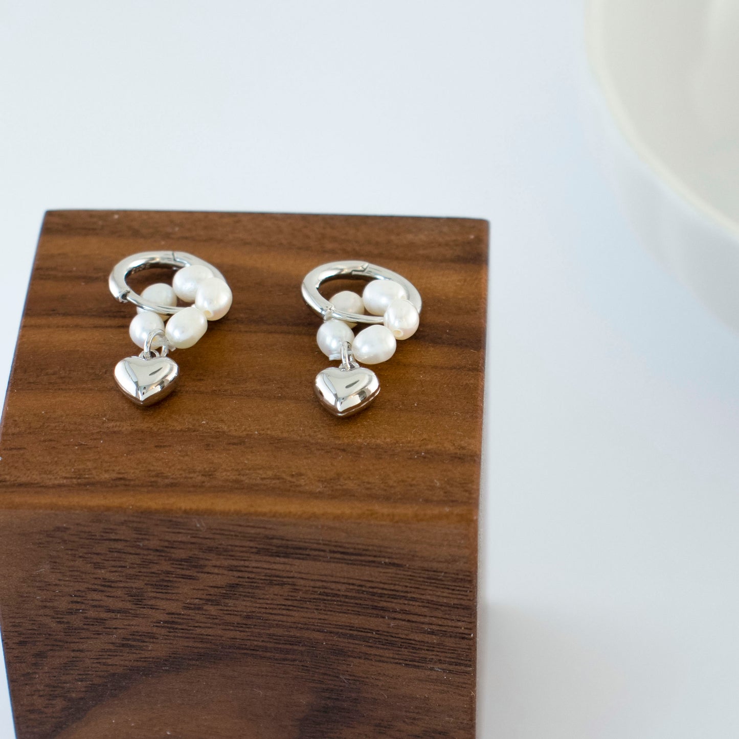 Embrace the timeless symbol of love with these earrings