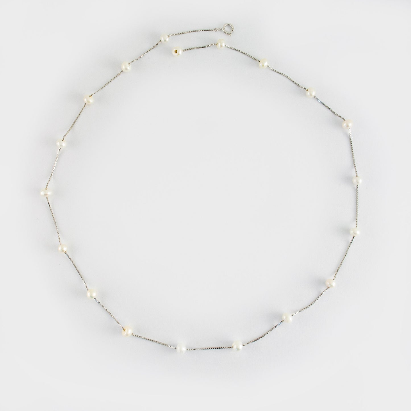 Necklace Etoile is adorned with 19 freshwater pearls, creating a constellation-like arrangement.