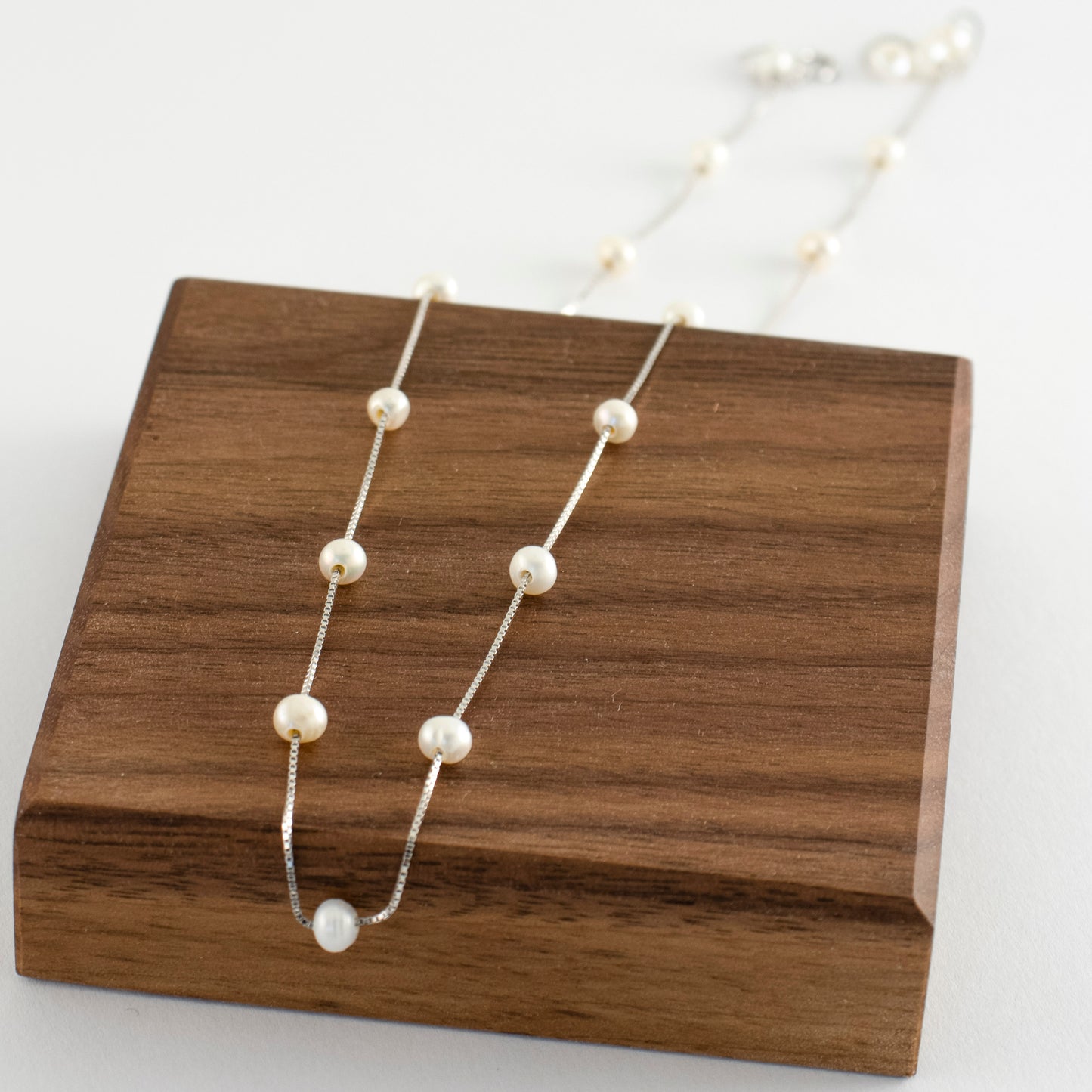 Necklace Etoile is adorned with 19 freshwater pearls, creating a constellation-like arrangement.