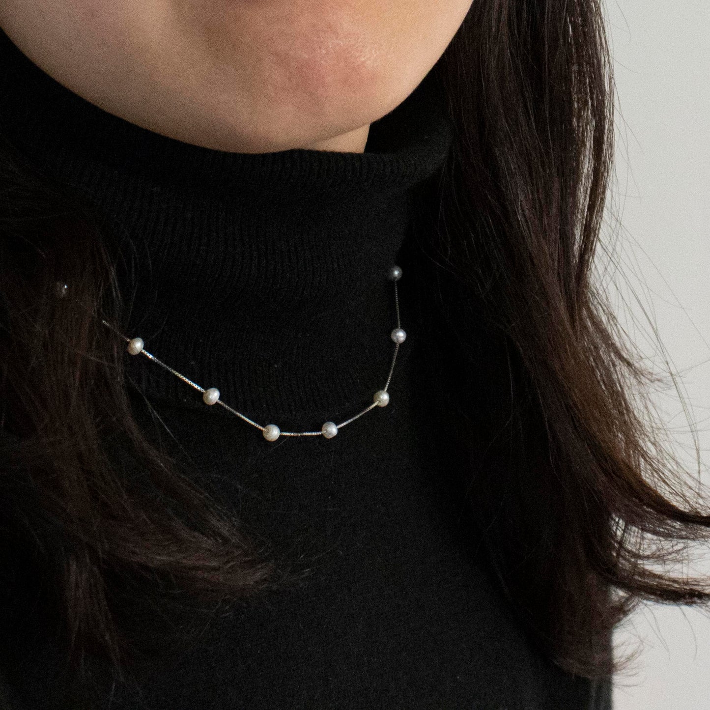 Necklace Etoile is adorned with 19 freshwater pearls, creating a constellation-like arrangement.
