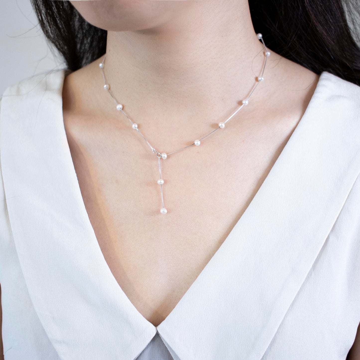 Necklace Etoile is adorned with 19 freshwater pearls, creating a constellation-like arrangement.